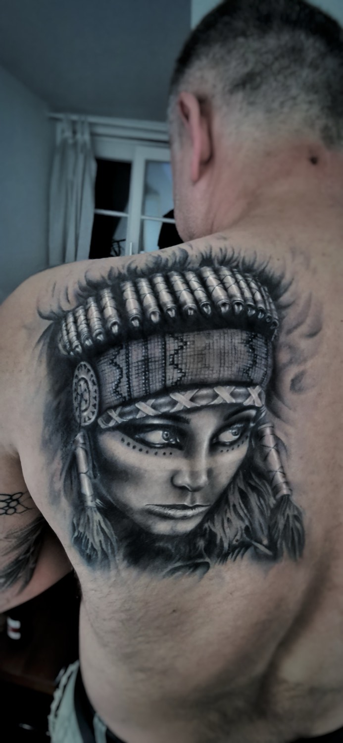 Portrait with feather embellishments on the shoulder