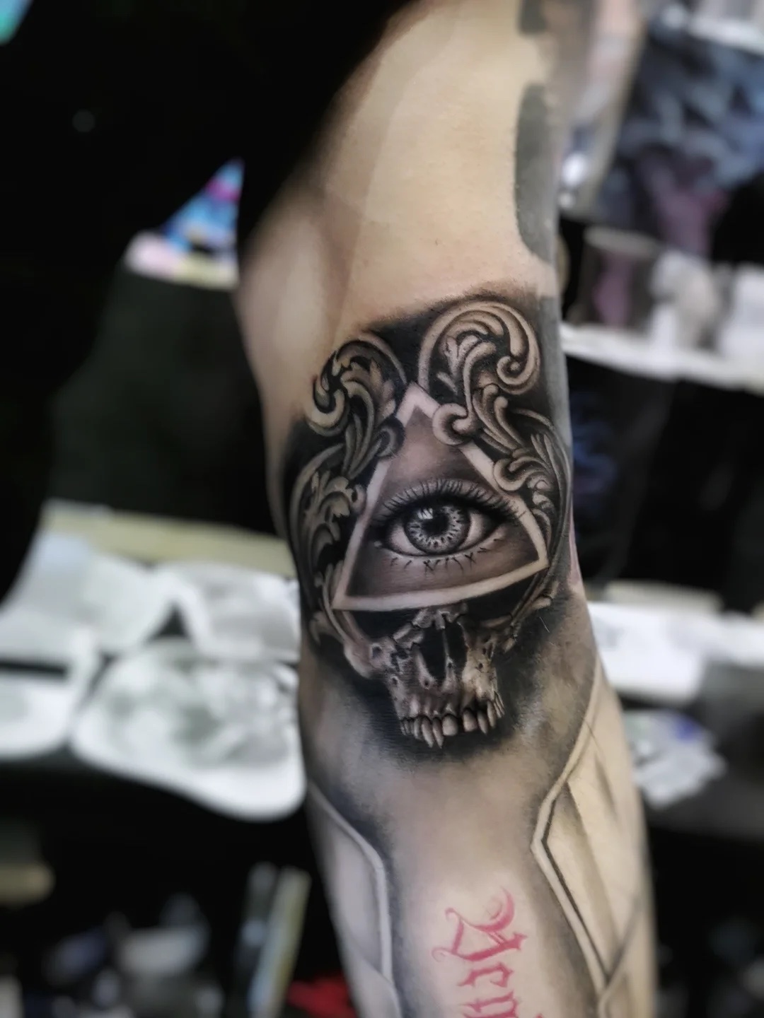 Ornamental eye over a skull on the bicep