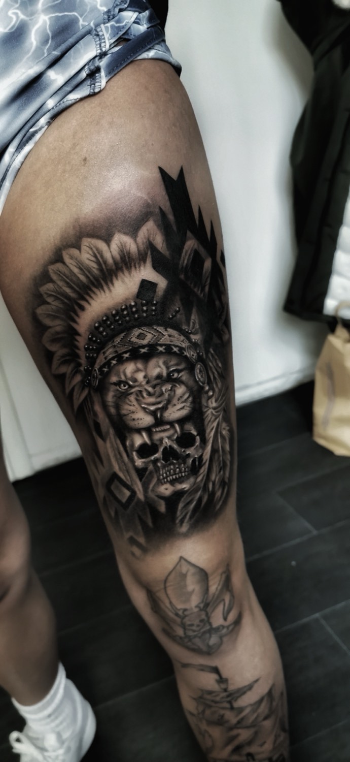 Lion with feather embellishments on the thigh